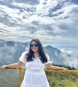 Aditi at a hill viewpoint
