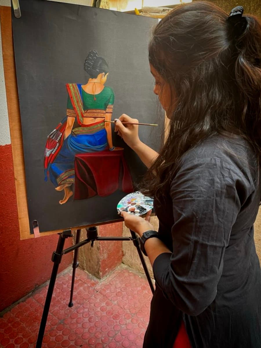 Aditi painting a portrait