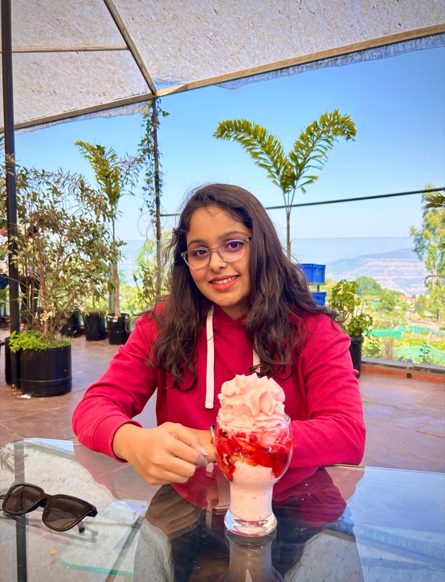 Aditi at a hilltop cafe